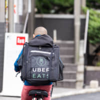 Independent operators: Uber Eats delivery personnel are their own bosses in that they possess their own vehicles and only work when they want to. | GETTY IMAGES