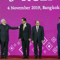 Prime Minister Shinzo Abe faces an uphill battle trying to persuade Indian Prime Minister Narendra Modi (left) to rejoin the Regional Comprehensive Economic Partnership negotiations. | AP
