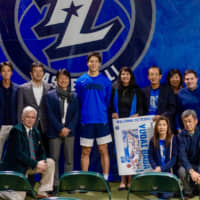 Texas Legends swingman Yudai Baba (center) poses for a photo with guests during a meet-and-greet session after the NBA G League team\'s home game on Dec. 13. | COURTESY OF TEXAS LEGENDS
