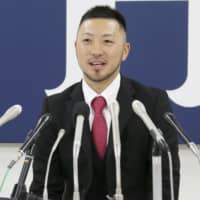 Carp second baseman Ryosuke Kikuchi speaks at a news conference on Friday in Hiroshima. | KYODO