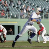 Retired Japanese baseball legend Ichiro Suzuki runs to first base during a sandlot-level game on Sunday at Hotto Motto Field in Kobe. | KYODO