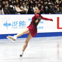 Rika Kihira performs her short program to \"Breakfast in Baghdad\" at the Japan Championships on Thursday at Yoyogi National Gymnasium. Kihira is in first place with 73.98 points. | RISA TANAKA