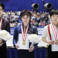 Men\'s national champion Shoma Uno (center), runner-up Yuzuru Hanyu (left) and third-place Yuma Kagiyama pose with their medals after the conclusion of the Japan Championships on Sunday at Yoyogi National Gymnasium. | KYODO