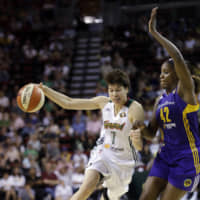 Seattle Storm forward Ramu Tokashiki drives against Jantel Lavender of the Los Angeles Sparks in the second half of Saturday\'s game in Seattle. The Storm defeated the Sparks 86-61. AP | AP