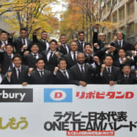 Japan\'s Brave Blossoms pose during a parade celebrating their Rugby World Cup achievements on Wednesday in Tokyo. | YOSHIAKI MIURA