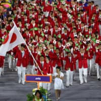 The Japanese team marches in the Parade of Nations during the opening ceremony for the 2016 Summer Olympics in Rio de Janeiro on Aug. 5, 2016. Japan will march last as the host nation during the 2020 opening ceremony in Tokyo. | KYODO