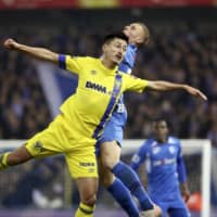 Sint-Truiden\'s Yuma Suzuki contends for the ball against a Genk player on Saturday in Genk, Belgium. | KYODO