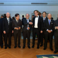 2019 winner of the Nobel Prize in chemistry Akira Yoshino shakes hands with Swedish Ambassador Pereric Hogberg  during a \"Reception in the Spirit of Nobel,\" which was also  attended by previous Nobel Prize winners, at the ambassador\'s residence in Tokyo on Nov. 26. | YOSHIAKI MIURA