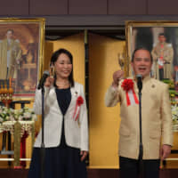 Thai Ambassador-Designate of the Kingdom of Thailand Singtong Lapisatepun (right) and Justice Minister Masako Mori (left) raise a toast to celebrate of the country’s National Day and the birthday of King Bhumibol Adulyadej at the Imperial Hotel, Tokyo on Dec. 5. | YOSHIAKI MIURA
