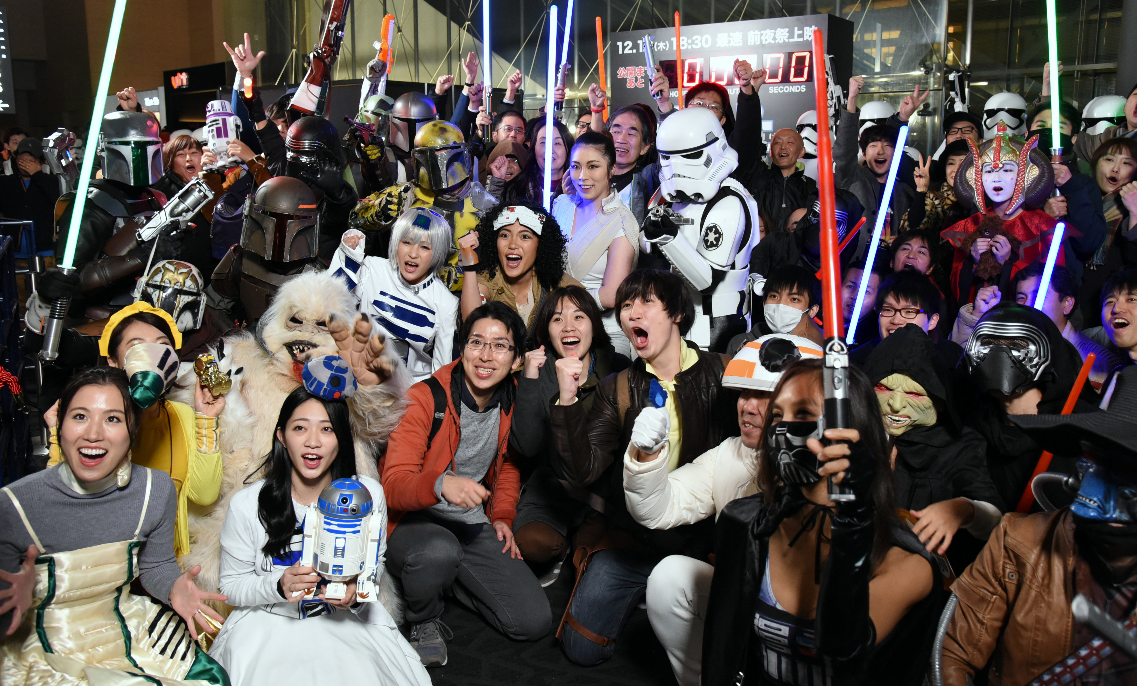 'Star Wars' fans wait excitedly Thursday outside a theater for a screening of 'Star Wars: The Rise of Skywalker' in Tokyo's Roppongi district. Nearly 1,000 fans gathered at the theater for the ninth episode of the original 'Star Wars' saga, which opens in theaters Friday. | SATOKO KAWASAKI