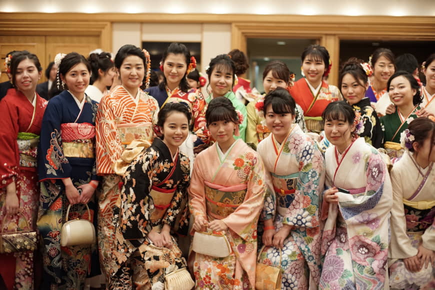Keio University students pose at a reception ceremony on Coming of Age Day at the Imperial Hotel on Monday. | RYUSEI TAKAHASHI
