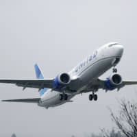 A United Airlines Boeing 737 Max  takes off in the rain at Renton Municipal Airport in Renton, Washington, last month. Boeing said Tuesday it is recommending that pilots receive training in a flight simulator before the grounded 737 Max returns to flying, a reversal of the company\'s long-held position that computer-based training alone was adequate. The 737 Max has been grounded worldwide since last March after two crashes killed 346 people. | AP