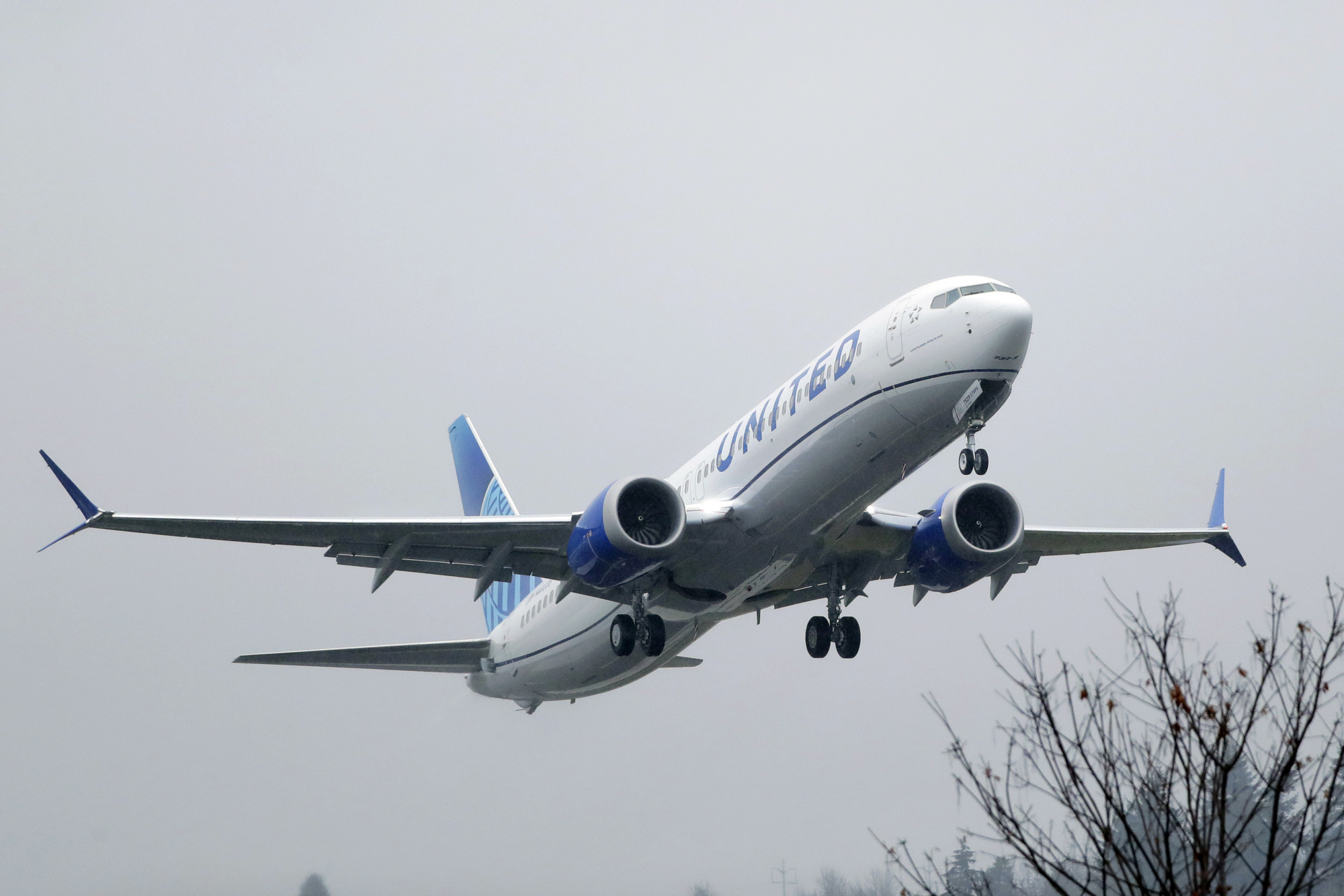 A United Airlines Boeing 737 Max  takes off in the rain at Renton Municipal Airport in Renton, Washington, last month. Boeing said Tuesday it is recommending that pilots receive training in a flight simulator before the grounded 737 Max returns to flying, a reversal of the company's long-held position that computer-based training alone was adequate. The 737 Max has been grounded worldwide since last March after two crashes killed 346 people. | AP
