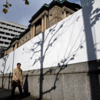 Citing slowing production due to weak demand from overseas, the Bank of Japan has downgraded its economic assessments of three out of the country\'s nine regions. | REUTERS