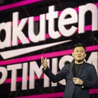 Rakuten Inc. CEO Hiroshi Mikitani speaks during the Rakuten Optimism 2019 conference in Yokohama last July. The e-commerce giant may face antimonopoly investigations by the Fair Trade Commission over its planned free shipping service. | BLOOMBERG