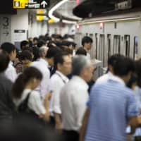 Mitsubishi Chemical Holdings Corp. will take part in a government plan to help reduce traffic congestion during the Olympics and Paralympics by allowing employees to work remotely instead of commuting. | BLOOMBERG