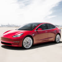 This undated photo provided by Tesla shows the 2019 Model 3. | JAMES LIPMAN / TESLA MOTORS / VIA AP