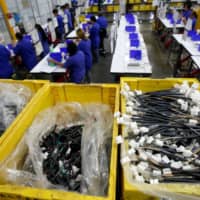 Ark de Mexico, an assembly factory that makes wire harnesses and electric components for the automobile industry, is seen in Ciudad Juarez, Mexico, last June. | REUTERS