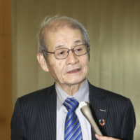 Akira Yoshino, who shared the Nobel Prize in chemistry last year, speaks to reporters Friday at the Prime Minister\'s Office in Tokyo. | KYODO