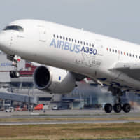 An Airbus A350 takes off from a runway at the aircraft builder\'s headquarters in Colomiers, near Toulouse, France, last September. | REUTERS