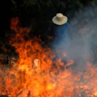 A tract of Amazon jungle is cleared with fire by loggers and farmers in Iranduba, Brazil\'s Amazonas state, on Aug. 20. | REUTERS