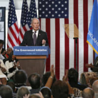 Democratic presidential candidate Michael Bloomberg is applauded as he speaks at the Greenwood Cultural Center in Tulsa, Oklahoma, Sunday. | AP