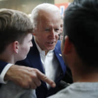 Former Vice President and Democratic presidential candidate Joe Biden meets with attendees at a campaign event Saturday in Las Vegas. | AP