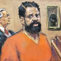 Grafton Thomas, a suspect in an attack at a Hasidic rabbi\'s home, appears with his defense attorney, Michael Sussman, at his arraignment at federal court in a courtroom sketch in White Plains, New York, Monday. | JANE ROSENBERG / VIA REUTERS