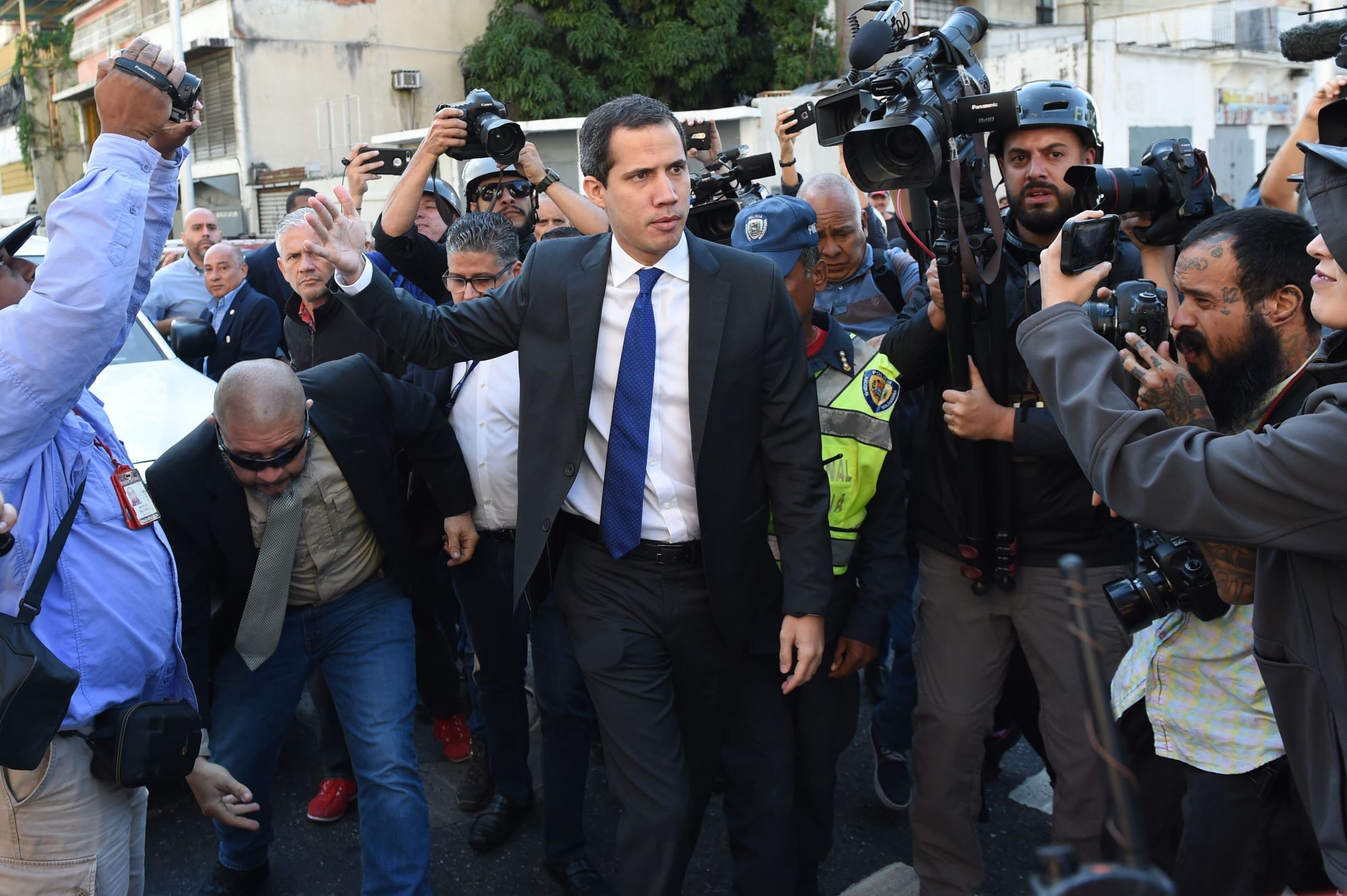 Venezuelan opposition leader and self-proclaimed acting president Juan Guaido gestures on his way to the National Assembly on Tuesday. | AFP-JIJI