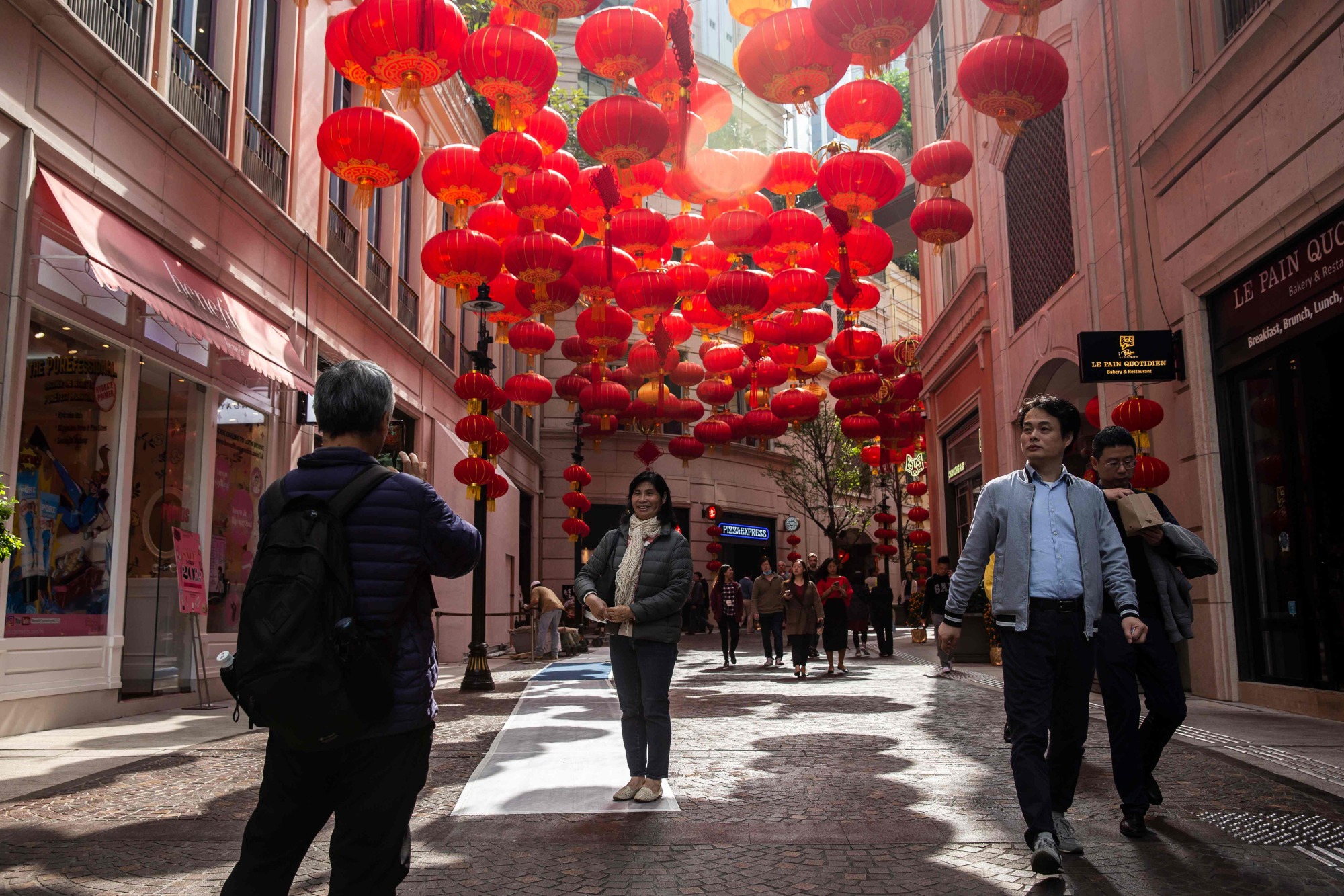 Lanterns for the coming Lunar New Year line a street in Hong Kong on Wednesday. | AFP-JIJI