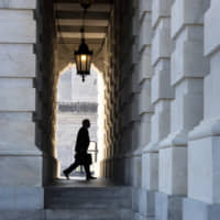 Supreme Court Chief Justice John Roberts arrives at the Capitol to preside over the impeachment trial of President Donald Trump on Wednesday. | AP