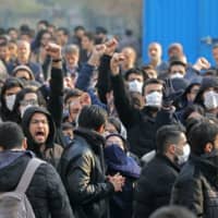 Iranian students gather for a demonstration over the downing of a Ukrainian airliner at Tehran University on Tuesday. | AFP-JIJI