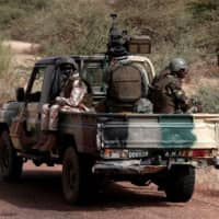 Malian Armed Forces soldiers are pictured during a regional anti-insurgent operation in Tassiga, Mali, in 2017. | REUTERS