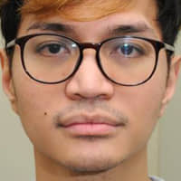 Indonesian student Reynhard Sinaga is seen in a police photo released Monday. Sinaga, Britain\'s most prolific rapist, was jailed for life Monday, with a minimum term of 30 years in prison, after being found to have drugged at least 48 men and filming himself sexually violating them while they were unconscious. | GREATER MANCHESTER POLICE / VIA AFP-JIJI