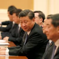 Chinese President Xi Jinping attends the bilateral meeting at the Presidential Palace in Naypyitaw, Myanmar, on Saturday. | REUTERS