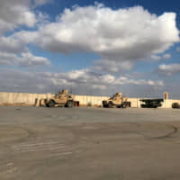 Military vehicles of U.S. soldiers are seen at Ain al-Asad air base in Anbar province, Iraq, Monday. | REUTERS