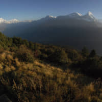 Trekkers watch the sun rise over the Annapurna Range (right) in central Nepal, as viewed from Poon Hill, above the village of Ghorepani in 2014. An avalanche swept the popular Annapurna circuit trekking route, which encircles Mount Annapurna, leaving at least four South Koreans and three Nepali guides missing, authorities said Saturday. | AP