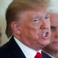 U.S. President Donald Trump delivers remarks following missile attacks by Iran on U.S. bases in Iraq as Vice President Mike Pence looks on in the White House on Wednesday. | REUTERS