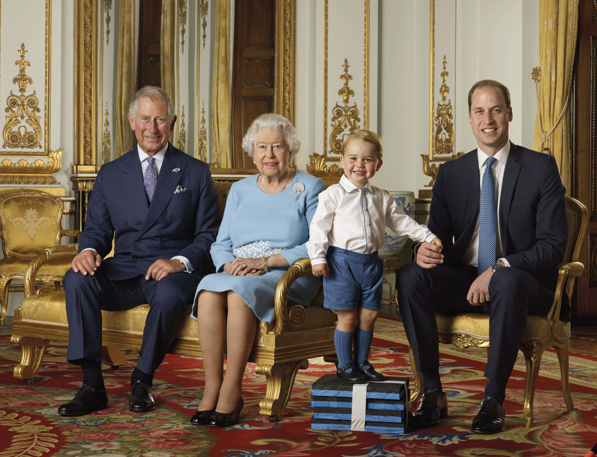 Prince Charles, Queen Elizabeth II, Prince George and Prince William in the White Drawing Room at Buckingham Palace in London in 2016 | RANALD MACKECHNIE/BUCKINGHAM PALACE / VIA AP