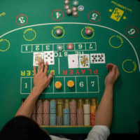 Following a casino-related bribery scandal that erupted in December, Prime Minister Shinzo Abe\'s government finds itself facing increased public opposition to casinos, which could delay the introduction of so-called integrated resorts in Japan. | AFP-JIJI