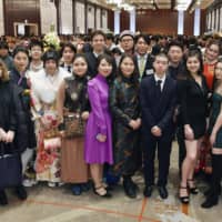 Foreign nationals attend a Coming of Age Day ceremony held in Shinjuku. 