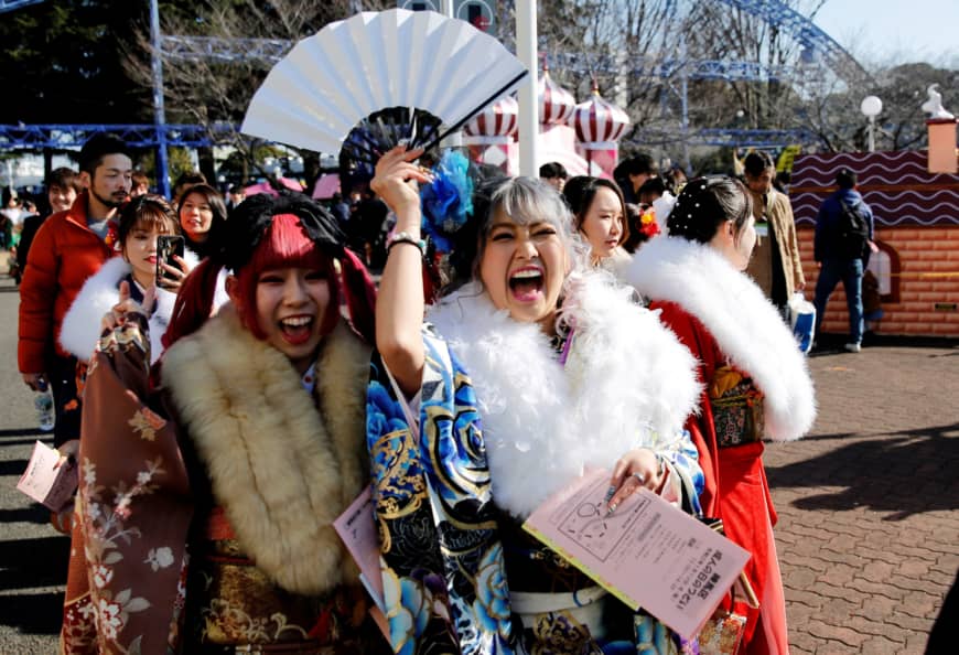 Japanese women wearing kimono attend their Coming of Age Day ceremony at Toshimaen amusement park in Tokyo on Sunday. | REUTERS