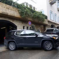 A car leaves the property of Carlos Ghosn, former head of Nissan Motor Co. and Renault SA, in Beirut on Jan. 2. | BLOOMBERG