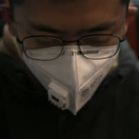 Surgical masks are in short supply as people rush to get them amid the continuing spread of the new coronavirus. | AP