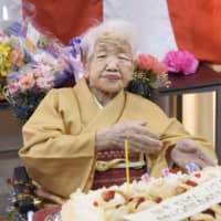 Kane Tanaka, the world\'s oldest person, who turned 117 on Thursday, is the center of attention at a party to mark the event held Sunday at the nursing home where she lives in Fukuoka. | KYODO