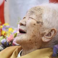 Kane Tanaka celebrates her 117th birthday at a nursing home in the city of Fukuoka on Sunday. | KYODO