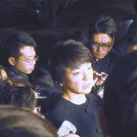 Upper House member Anri Kawai, the wife of former Justice Minister Katsuyuki Kawai, speaks to reporters on Jan. 15 in Tokyo. | REIJI YOSHIDA