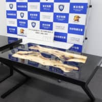 Confiscated tables that contained stimulants within the tabletops are shown to the media on Monday at the Haneda branch of Tokyo Customs. | KYODO