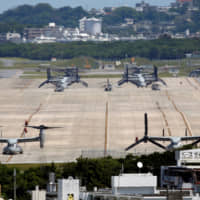 U.S. Marine Corps MV-22 Osprey aircraft are seen at U.S. Marine Corps Air Station Futenma in Ginowan, Okinawa Prefecture, in March 2018. | REUTERS