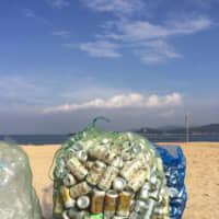 Ready to go: Bags of PET bottles and cans wait to be picked up by recycling trucks. | AMY CHAVEZ